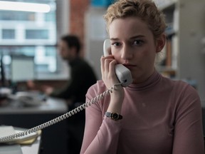 Julia Garner plays an assistant whose jobs include fending off the boss's wife on the phone.