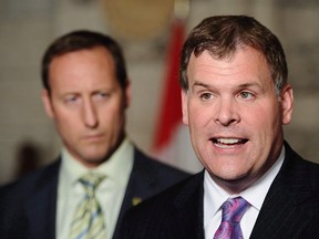 Current Conservative leadership candidates John Baird, right, and Peter MacKay speak to reporters in the foyer of the House of Commons in Ottawa on June 22, 2011, when Baird was foreign affairs minister and MacKay was defence minister.