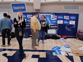 Supporters of Democratic U.S. presidential candidate Sen. Bernie Sanders wait for results at their caucus site in Des Moines, Iowa, on Feb. 3, 2020.