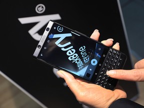 An attendee uses the camera on a BlackBerry KEYone smartphone at the IFA consumer electronics show in Berlin on Sept. 1, 2017.