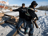 A protester tries to block counter protesters from tearing down a blockade along the CN rail line in Edmonton, Feb. 19, 2020.