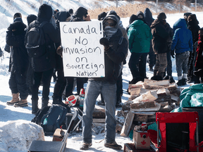 Protesters at blockade on the train tracks in Longueuil, Que., on Feb. 20, 2020.