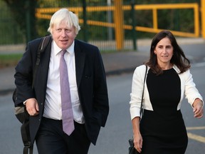 Boris Johnson and his wife Marina arrive at Ruislip High School on September 12, 2014 in Uxbridge, England.