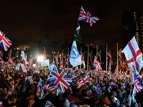 Brexit supporters wave Union flags as they gathered in Parliament Square, the venue for the Leave Means Leave Brexit Celebration in central London on January 31, 2020, the day that the UK formally leaves the European Union.