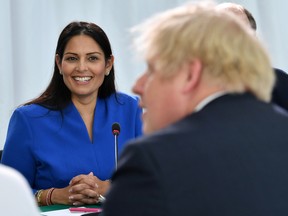 Britain's Home Secretary Priti Patel looks on as Britain's Prime Minister Boris Johnson chairs a cabinet meeting at the National Glass Centre at the University of Sunderland, Sunderland, Britain January 31, 2020.
