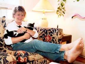 Christie Blatchford relaxes at home near Christie Pits where she lived with her beloved pets on Oct. 6, 1984.