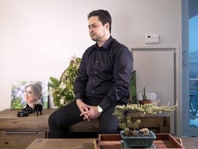 Hassan Shadkhou sits in his Toronto apartment next to a photo of his wife, Sheyda, on Tuesday February 4, 2020. Sheyda Shadkhou was killed along with 175 others when her plane crashed minutes after take off in Tehran on Jan. 8, 2020.