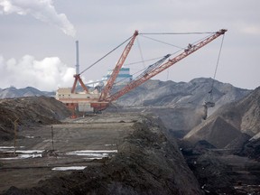 A dragline works in coal pits in front of the SaskPower Shand Power Station on Tuesday, March 19, 2008 south of Estevan, Saskatchewan. The town is set to receive $8 million as investment for the coal community.