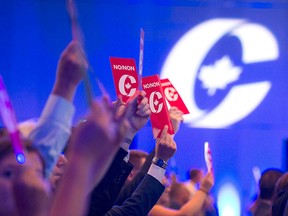 Delegates vote on party constitution items at the Conservative Party of Canada national policy convention in Halifax on Aug. 24, 2018.