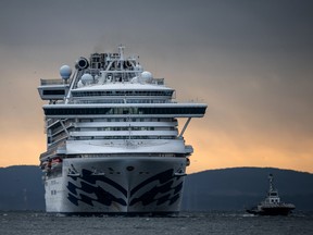 The Diamond Princess cruise ship approaches Daikoku Pier while it remains in quarantine off the port of Yokohama, Japan, after a number of the 3,700 passengers were confirmed to have coronavirus, Feb. 6, 2020.