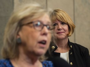 Green Party Interim Leader Jo-Ann Roberts looks on as Green Party Parliamentary Leader Elizabeth May speaks to reporters following a meeting with Prime Minister Justin Trudeau in his office on Parliament Hill in Ottawa on November 15, 2019.