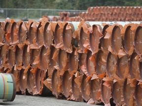 Pipeline pipes are seen at a Trans Mountain facility near Hope, B.C., on August 22, 2019. Canada's budget watchdog is projecting economic growth during the final quarter of 2019 will be "significantly weaker" than predicted in his fall report. In its latest report on near-term growth, the Parliamentary Budget Office says real GDP growth in the final three month period of last year will likely come in at near stagnant levels, at an annual rate of 0.3 per cent.