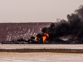 Smoke billows up from a derailed Canadian Pacific Railway train near Guernsey, Sask., on February 6, 2020.
