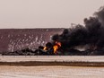 Smoke billows up from a derailed Canadian Pacific Railway train near Guernsey, Sask., on February 6, 2020.