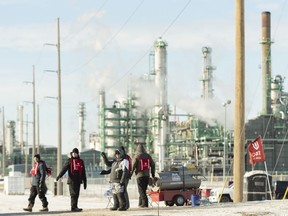 Unifor 594 members walk the picket line at the Co-op Refinery in Regina on Tuesday January 21, 2020. Regina police have arrested four more people involved in a labour dispute at the Co-op oil refinery.