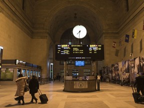 People make their way through Union Station in Toronto as the departure display for Via Rail show all trains have been cancelled on February 13, 2020. Via Rail says it is temporarily laying off 1,000 employees due to blockades that continue to halt service on CN tracks in Eastern Canada. The Crown corporation has suspended passenger trains on its Montreal-Toronto and Ottawa-Toronto routes for about two weeks in the wake of protests that have disrupted rail service across the country.