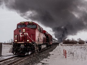 Smoke billows up from a derailed Canadian Pacific Railway train near Guernsey, Sask., on February 6, 2020. The estimate for how much oil spilled in the latest train derailment in rural Saskatchewan has increased. Saskatchewan's Ministry of Environment says the latest figures provided by Canadian Pacific Railway show around 1.6 million litres of oil spilled after a freight train jumped the tracks Feb. 6 resulting in a fiery crash near Guernsey, about 115 kilometres southeast of Saskatoon.