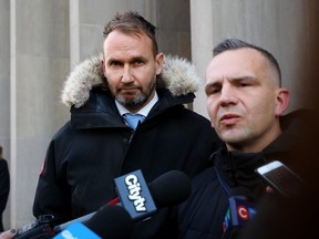 Gavin MacMillan is seen with his lawyer (right) Sean Robichaud outside Ontario Superior Court in Toronto on Wednesday, Jan. 29, 2020.