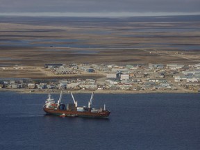 A cargo ship sits in the bay at Cambridge Bay Nunavut, on September 2, 2017. The federal government has announced it will support an international ban on the use of environmentally damaging heavy fuel oils in Arctic shipping. The announcement comes despite concerns that forcing shippers to use more expensive fuels will raise costs for northern families.