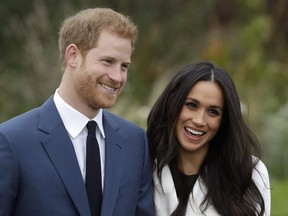 Britain's Prince Harry and his fiancee Meghan Markle pose for photographers during a photocall in the grounds of Kensington Palace in London Monday Nov. 27, 2017. Public Safety Canada says the RCMP has been providing security for the Duke and Duchess of Sussex since November, but plans to stop in coming weeks. A statement from Minister Bill Blair's office says Harry and Meghan's part-time move to Canada presented "a unique and unprecedented set of circumstances."