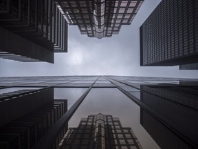 Bank buildings are photographed in Toronto's financial district on June 27, 2018. The province has appointed a taskforce to review Ontario's capital markets regulations and advise on how they can be modernized. The ministry of finance says in a statement that executives with experience at Aimia Inc., Sun Life Financial Inc., GMP Securities LP, Norton Rose Fulbright and Kingsdale Advisors will form the taskforce.