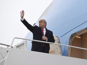 President Donald Trump waves from the top of the steps of Air Force One at Andrews Air Force Base in Md., Friday, Jan. 31, 2020. U.S. President Donald Trump's decision to slap visa restrictions on six new countries could affect immigration flows to Canada, if history is any indication. Past moves on immigration policy by his administration on Haiti and Iran saw asylum claims and student visa applications in Canada jump.
