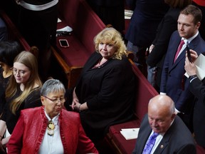 Senator Lynn Beyak waits for the Throne Speech in the Senate chamber in Ottawa, Thursday, Dec. 5, 2019. The Metis National Council is demanding an apology from Sen. Lynn Beyak and says she should consider resigning for reportedly claiming to be Metis because her parents adopted an Indigenous child.