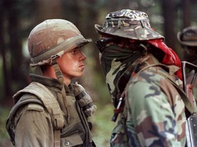 Canadian soldier Patrick Cloutier and Saskatchewan Native Brad Laroque alias "Freddy Kruger" come face to face in a tense standoff at the Kahnesatake reserve in Oka, Que., Saturday, Sept. 1, 1990.