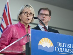 British Columbia Health Minister Adrian Dix looks on as Provincial Health Officer Dr. Bonnie Henry addresses the media during a news conference at the BC Centre of Disease Control in Vancouver B.C, Tuesday, January 28, 2020.THE CANADIAN PRESS/Jonathan Hayward