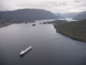 A tanker is anchored in Burrard Inlet just outside of Burnaby, B.C., on Friday, Nov. 25, 2016. lmost $150 million allocated to help protect Canada's oceans has gone unspent by the Trudeau government over the past two years.