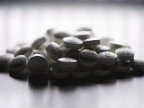 Prescription pills containing oxycodone and acetaminophen are shown on June 20, 2012. How governments fund the country's fight against the opioid crisis may contribute to "a lack of progress" on the issue, says newly disclosed documents that probe an alternative financing model eyed by Health Canada.