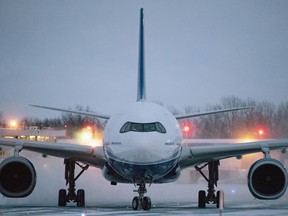 A plane carrying 176 Canadian citizens from the centre of the global novel coronavirus outbreak in Wuhan, China, arrives at CFB Trenton, in Trenton, Ont., on Friday, Feb. 7, 2020. Hundreds of Canadians and their family members are to be released from quarantine today after two weeks in isolation at an Ontario Canadian Forces base.