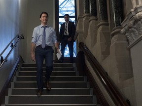 Prime Minister Justin Trudeau makes his way to a caucus meeting in West block, Wednesday, December 11, 2019 in Ottawa. Federal cabinet ministers now have their own special hotline to report suspected hacking incidents.