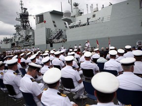 The HMCS Calgary is seen behind sailors during a change of command ceremony at CFB Esquimalt, in Esquimalt, B.C., Wednesday, June 24, 2015. The Royal Canadian Navy and Canadian Coast Guard say they hundreds more sailors as recruitment has failed to keep pace with attrition.THE CANADIAN PRESS/Chad Hipolito