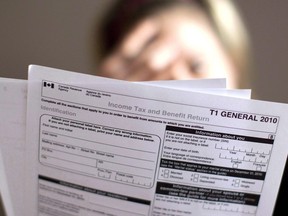 A tax return form is pictured in Toronto on Wednesday April 13, 2011. The Canada Revenue Agency is sending an unlikely message to kick off tax season: Paper-filers, we have not forgotten you. Despite a years-long push to have more people file taxes online because it's generally faster and easier, many Canadians still prefer putting pen, or pencil, to paper.