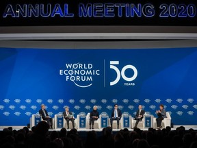 From left to right, Zhu Min, deputy managing director of the International Monetary Fund (IMF), Haruhiko Kuroda, governor of the Bank of Japan (BOJ), Christine Lagarde, president of the European Central Bank (ECB), Steven Mnuchin, U.S. Treasury secretary, Olaf Scholz, Germany's finance minister, and Kristalina Georgieva, managing director of the International Monetary Fund (IMF), attend a panel session on the closing day of the World Economic Forum (WEF) in Davos, Switzerland, on Friday, Jan. 24, 2020.