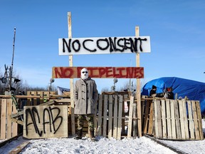 Supporters of Wet'suwet'en hereditary chiefs camp at a railway blockade as part of protests against British Columbia's Coastal GasLink pipeline, in Edmonton on Feb.19, 2020.