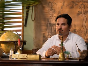 "Smiles, everyone! Smiles!" Michael Peña is your host, Mr. Roarke, in Fantasy Island.