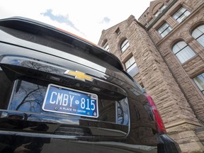 One of Ontario Premier Doug Ford's vehicles sits parked at the Ontario Legislature sporting a new licence plate in Toronto on Feb. 20, 2020.