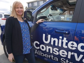 Laureen Harper, the wife of former Prime Minister Stephen Harper, stands by the United Conservative Party campaign truck during a stop in Calgary-Bow on Tuesday, April 9, 2019.