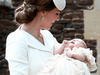 Catherine, Duchess of Cambridge, carries her daughter, Princess Charlotte as they arrive for Charlotte’s Christening in Sandringham, England, on July 5, 2015.