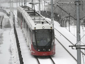 An OC Transpo LRT train heads towards Lees Station on the Confederation Line during a snowstorm in Ottawa, Thursday, Feb. 27, 2020.