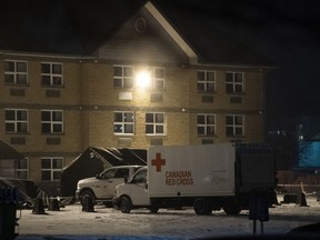 A Canadian Red Cross truck sits outside the Yukon Lodge at CFB Trenton, where Canadians returning on a charter flight from Wuhan, China, will be temporarily housed for a quarantine period to be monitored for signs of the novel coronavirus, in Trenton, Ont., Thursday, Feb. 6, 2020.