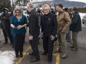 Minister of Crown-Indigenous Relations Carolyn Bennett and B.C. Indigenous Relations Minister Scott Fraser walk away after addressing the media in Smithers, B.C., Friday, February 28, 2020. The hereditary chiefs of the Wet'suwet'en are scheduled to meet for a second day with senior federal and provincial ministers today as they try to break an impasse in a pipeline dispute that's sparked national protests and led to disruptions in the economy.