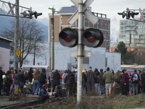 Protesters block a set of train tracks in East Vancouver, Monday, February, 10, 2020. The protesters are standing in solidarity with the Wet'suwet'en members opposed to the LNG pipeline in northern British Columbia.