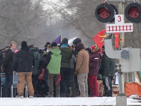 Indigenous Services Minister Marc Miller looks back during a meeting with protesters at a rail blockade on the tenth day of demonstration in Tyendinaga, near Belleville, Ont., Saturday, Feb. 15, 2020. The protest is in solidarity with the Wet'suwet'en hereditary chiefs opposed to the LNG pipeline in northern British Columbia.