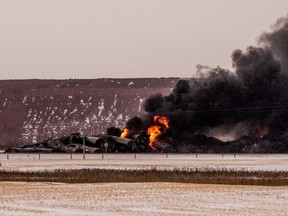 Smoke billows up from a derailed Canadian Pacific Railway train near Guernsey, Sask., on Thursday, February 6, 2020.