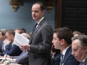 Quebec Finance Minister Eric Girard tables a legislation on December 5, 2019 at the legislature in Quebec City.