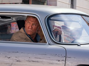 James Bond (Daniel Craig) drives through Matera, Italy in NO TIME TO DIE,   a DANJAQ and Metro Goldwyn Mayer Pictures film.
