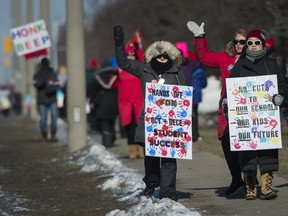Teachers from the Peel District School Board hold a one day strike in Mississauga, Ont., on Friday, February 21, 2020. Ontario's public elementary teachers are threatening more job action in two weeks -- and they aren't ruling out a full strike.